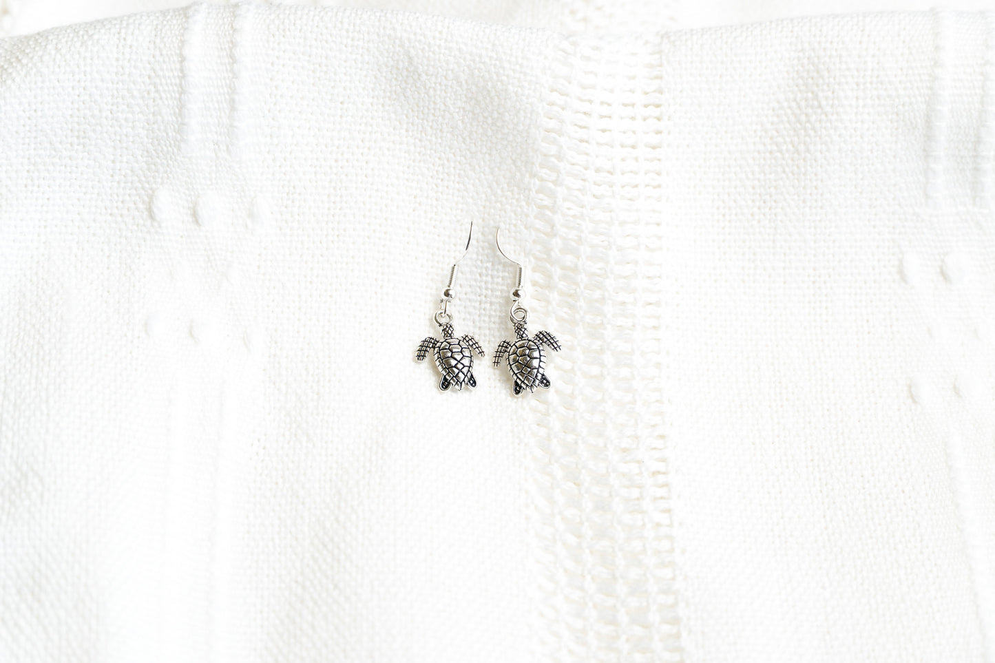 Small turtle dangle earrings