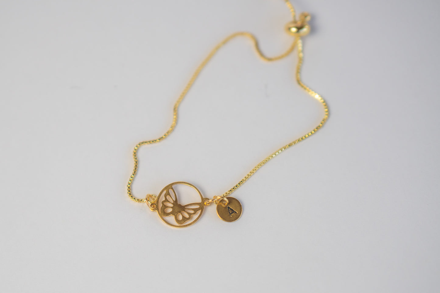 Gold Butterfly in a circle Bracelet