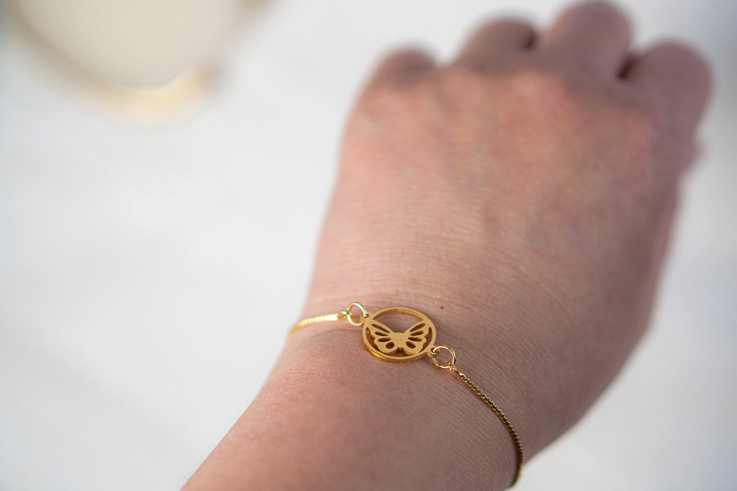 Gold Butterfly in a circle Bracelet